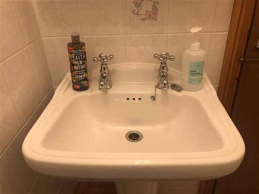 Sink in en-suite shower room with Faith and Nature soap at Forda farm Bed and Breakfast, EX22 7BS.